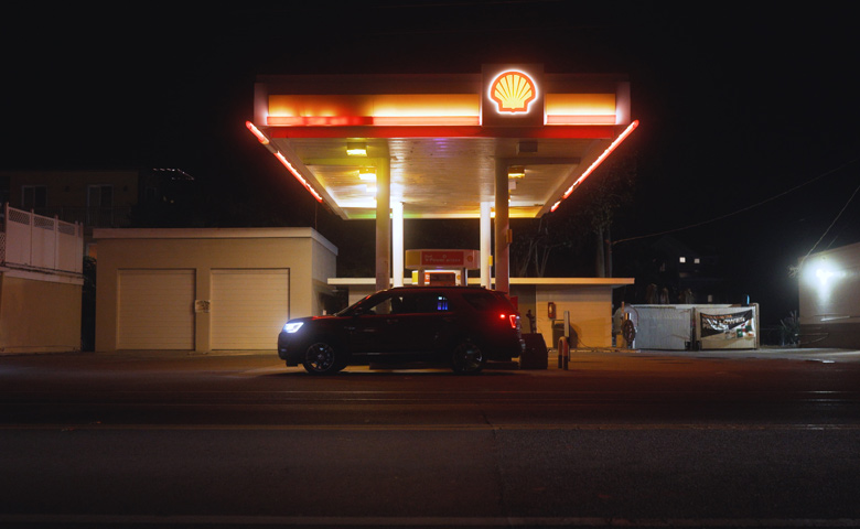 Gas station at night with dim yellow lights