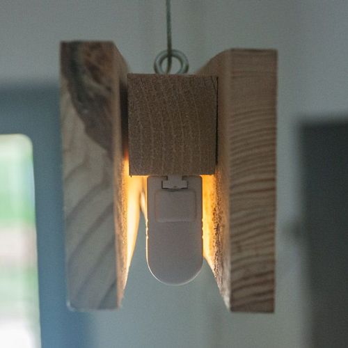 thin, solid pendant light with thick housing